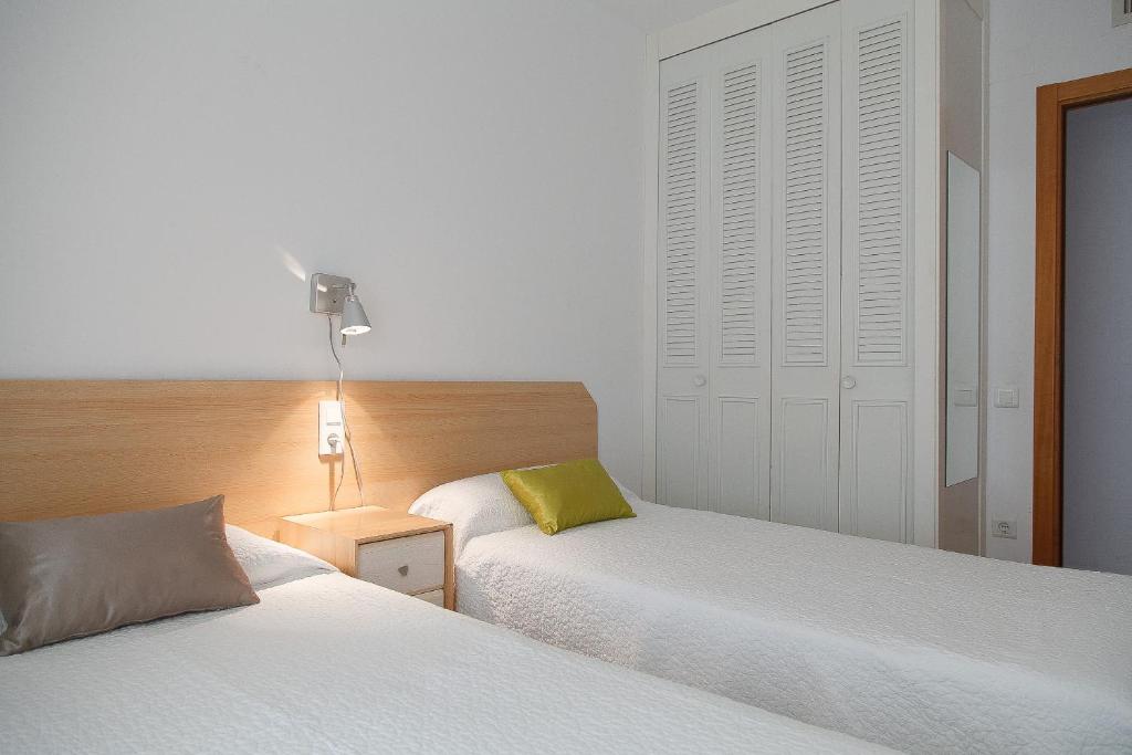 Postel nebo postele na pokoji v ubytování UHC Ventura Park Apartments