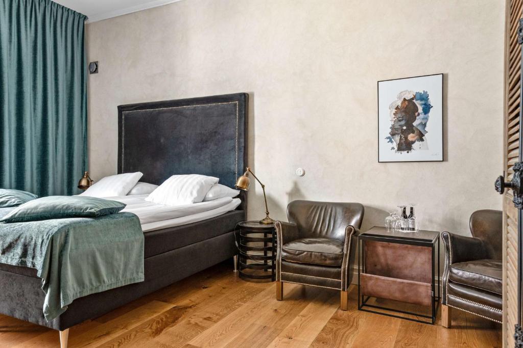 Postel nebo postele na pokoji v ubytování Donners Hotell