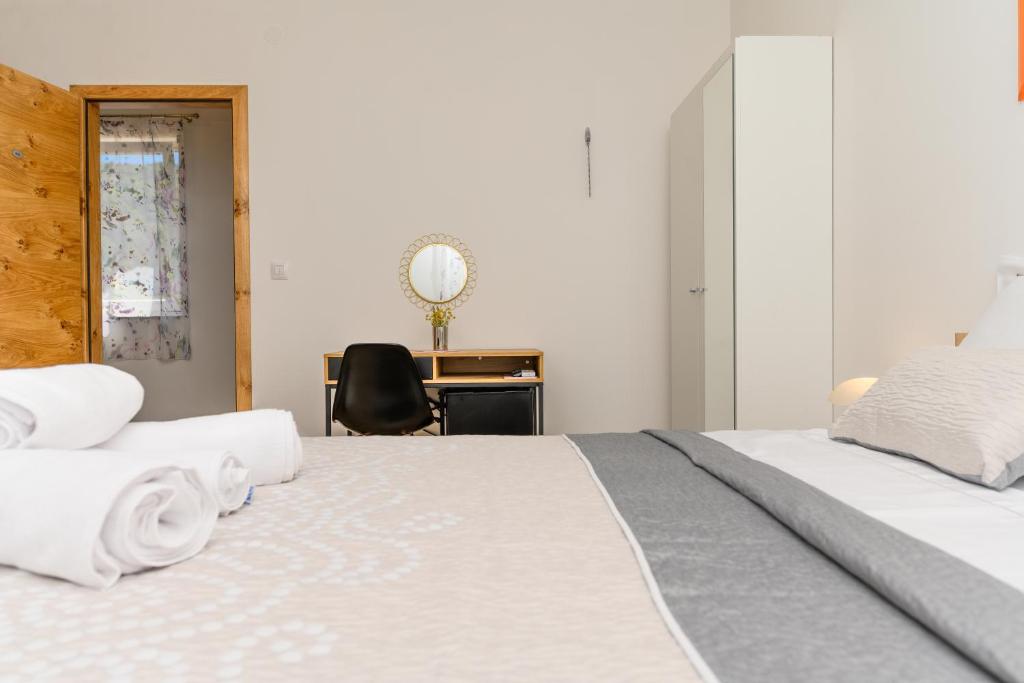 Voodi või voodid majutusasutuse Rooms FOREVER toas