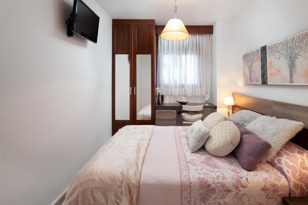Posteľ alebo postele v izbe v ubytovaní Apartamento Playa Motril Golf