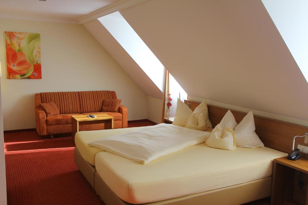 Postel nebo postele na pokoji v ubytování Abasto Hotel Eichenau