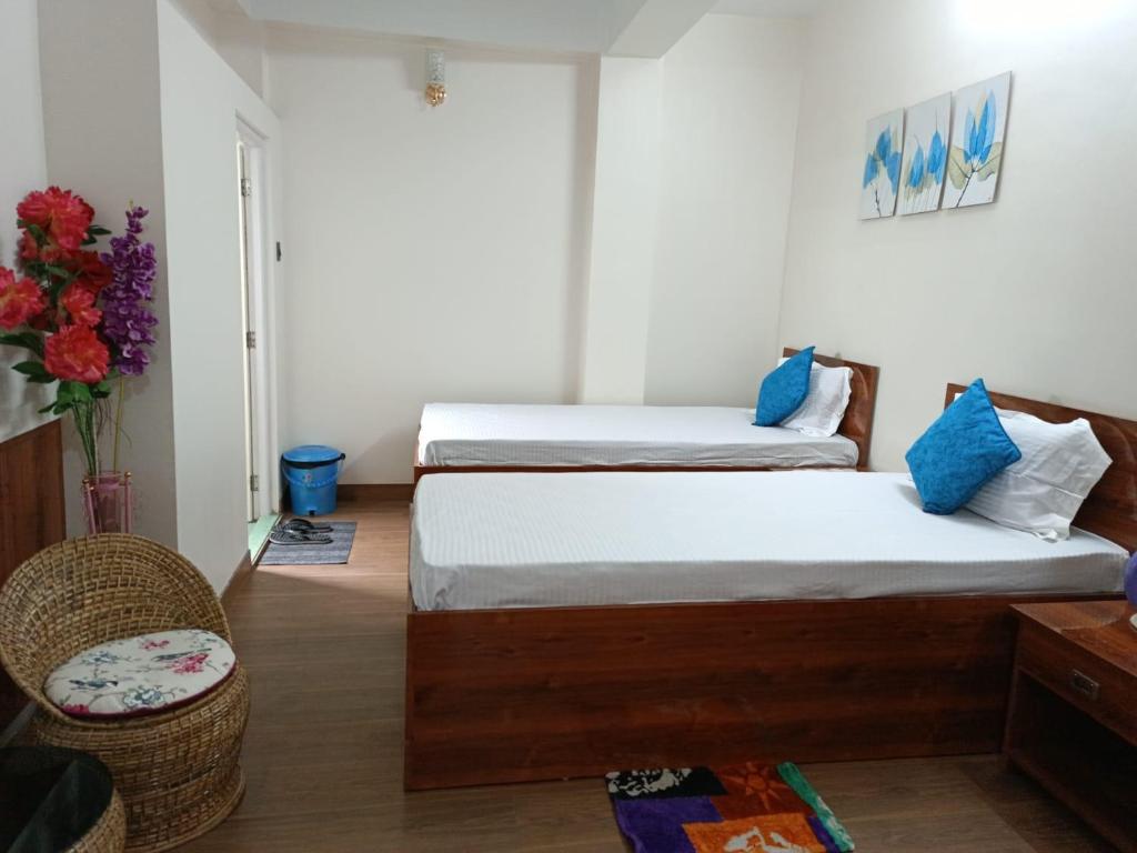 Postel nebo postele na pokoji v ubytování Maple Homestay