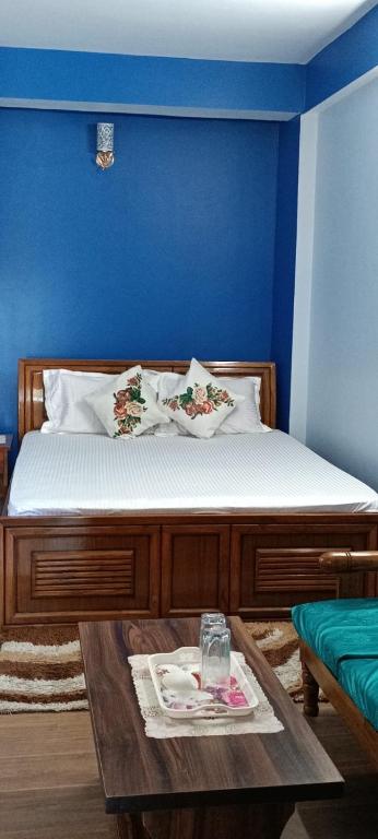 Postel nebo postele na pokoji v ubytování Maple Homestay