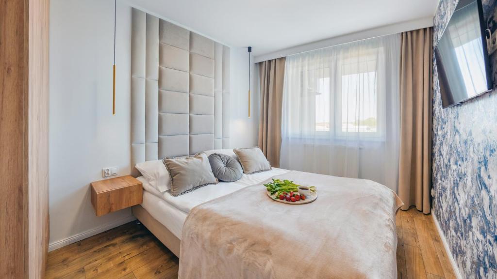 מיטה או מיטות בחדר ב-Apartament Morski z parkingiem 32 F Perłowa Przystań - Holiday City