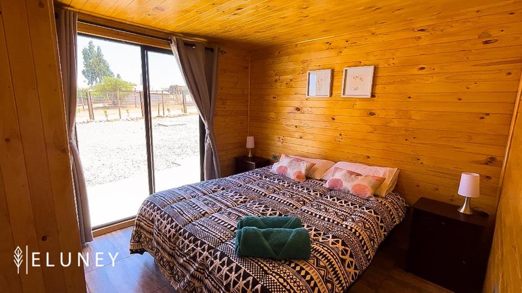 Postel nebo postele na pokoji v ubytování ELUNEY Combarbala