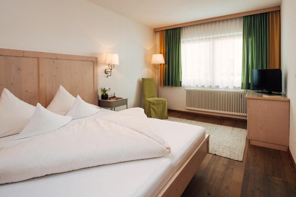 Postel nebo postele na pokoji v ubytování Hotel Regina