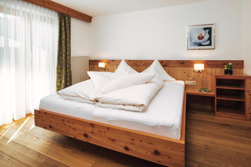Postel nebo postele na pokoji v ubytování Hotel Regina
