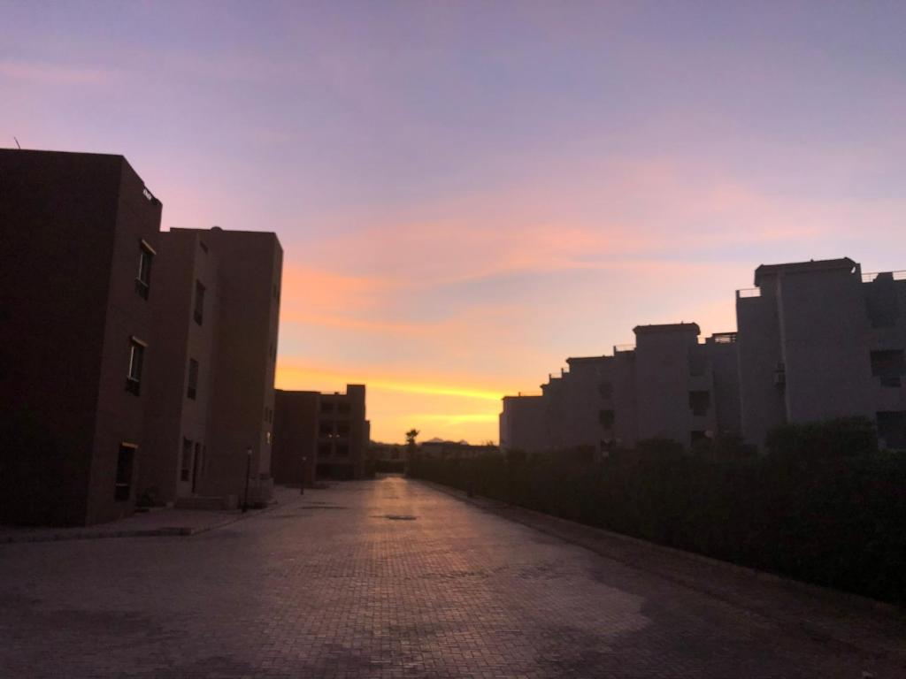 an empty street in a city at sunset at Luxury Two bedrooms flat with pool view in Sharm El Sheikh