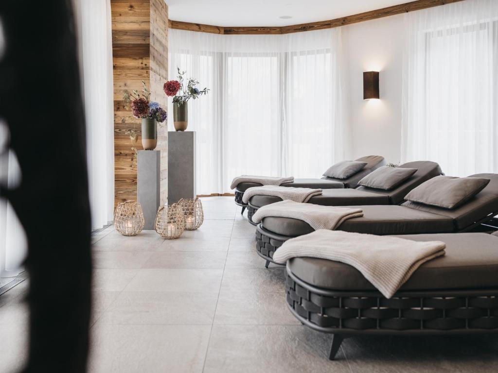 a waiting room with a row of chaise chairs at VAYA Sölden inklusive Summer Card in Sölden