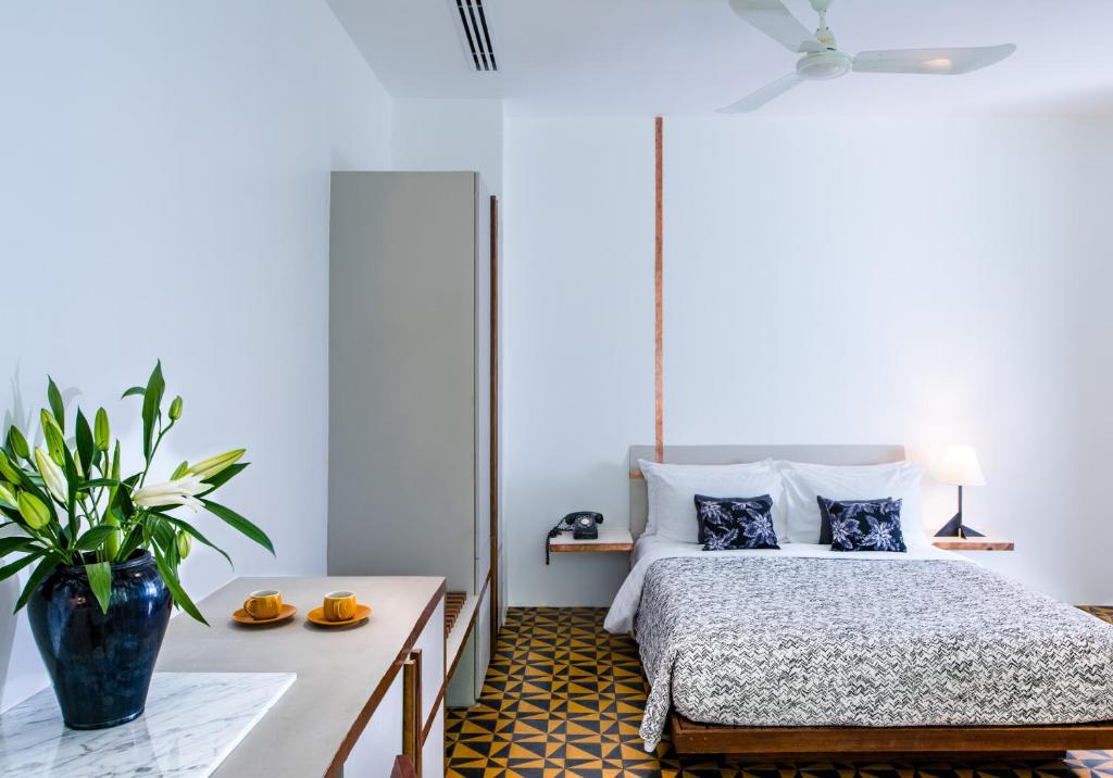Postel nebo postele na pokoji v ubytování Atelier Hotel