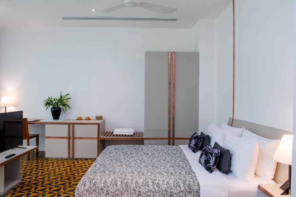 Postel nebo postele na pokoji v ubytování Atelier Hotel