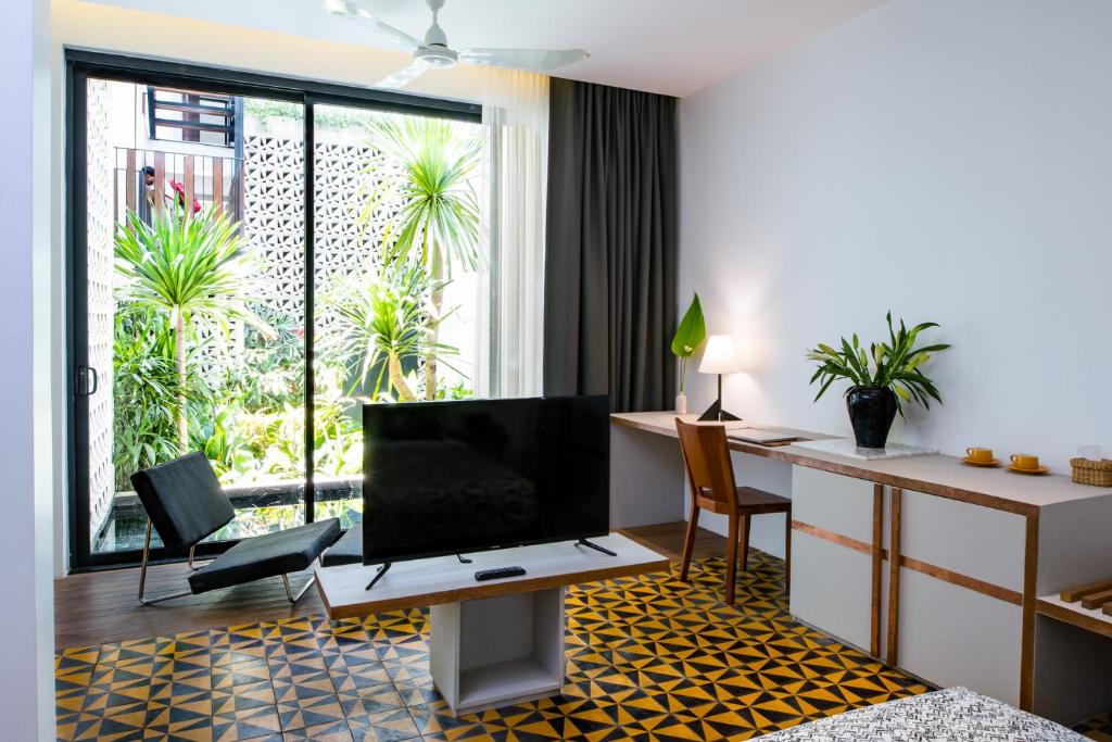 TV a/nebo společenská místnost v ubytování Atelier Hotel