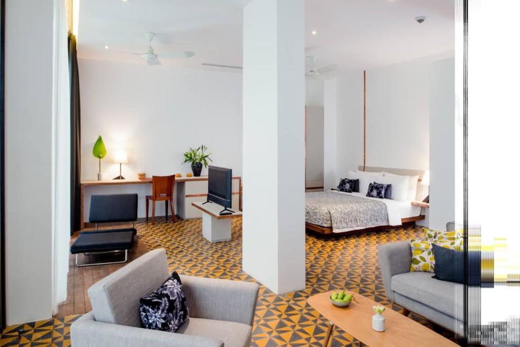 Postel nebo postele na pokoji v ubytování Atelier Hotel