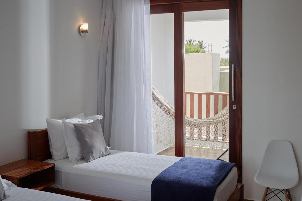 Postel nebo postele na pokoji v ubytování Aiolos Hotel & Discoveries