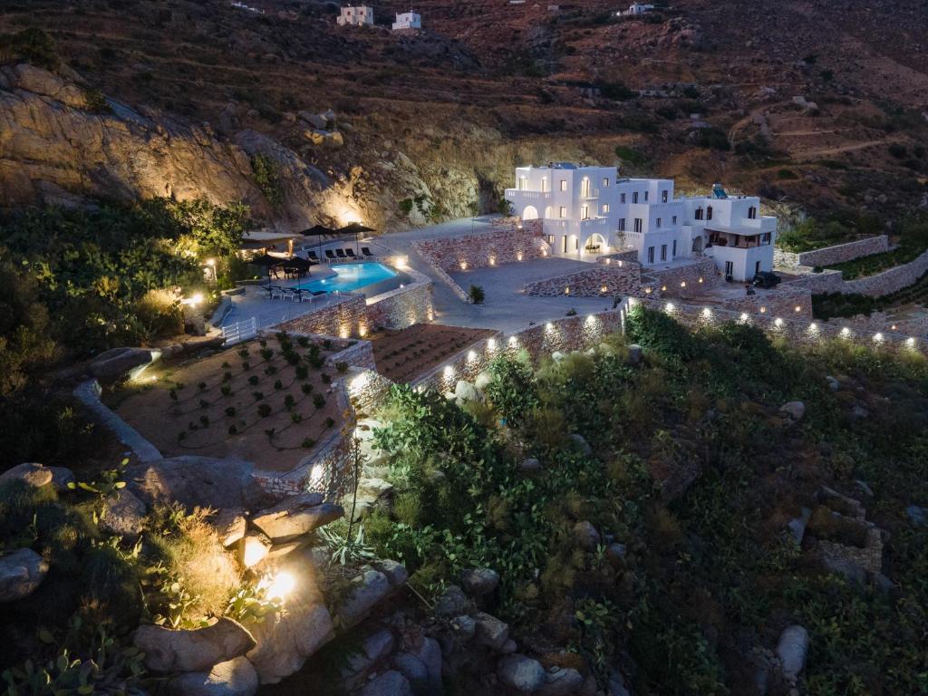 an aerial view of a resort at night with lights at WOW Panoramic View Deluxe Villas in Agkidia