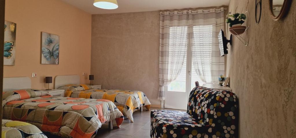 Postel nebo postele na pokoji v ubytování Affittacamere Borgo Sabbionara