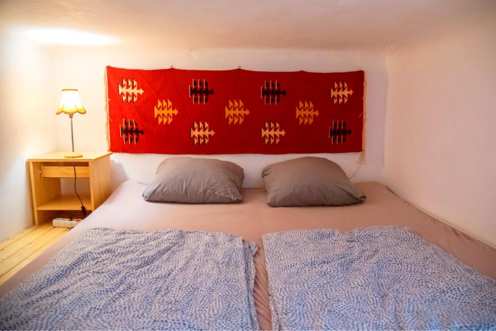 Postel nebo postele na pokoji v ubytování Das Nest Budapest