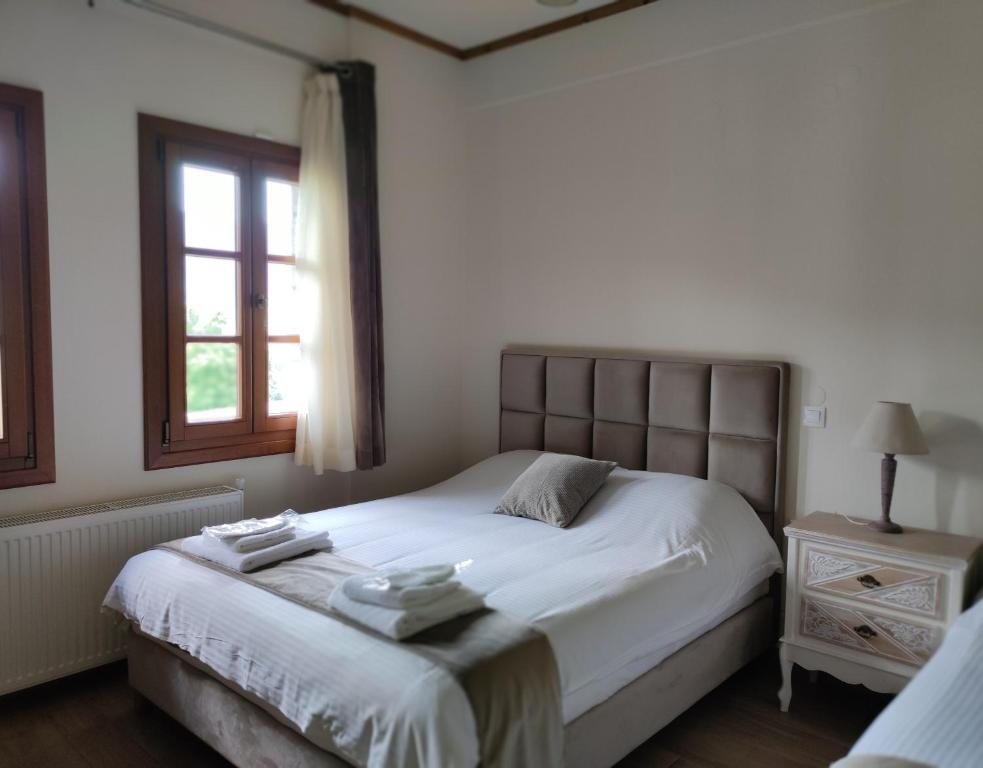 Postel nebo postele na pokoji v ubytování NUCA GUESTHOUSE