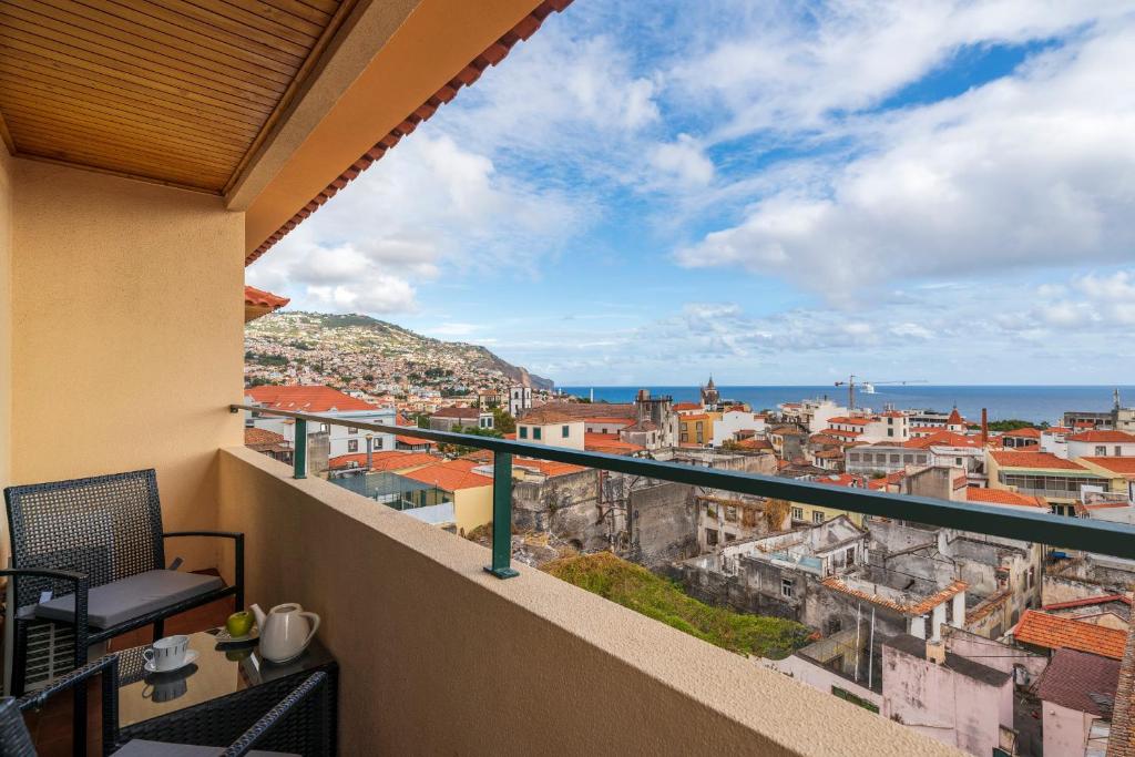 a balcony with a view of the city at Casa Sta Clara in Funchal