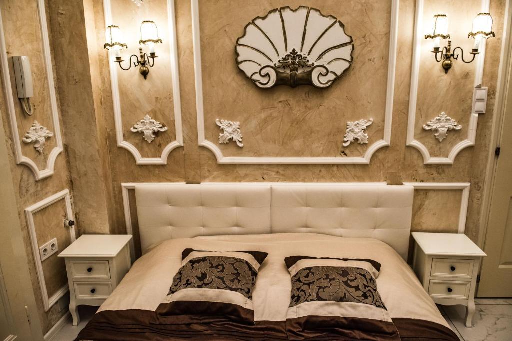 Postel nebo postele na pokoji v ubytování Exclusive Szálláshely Szeged