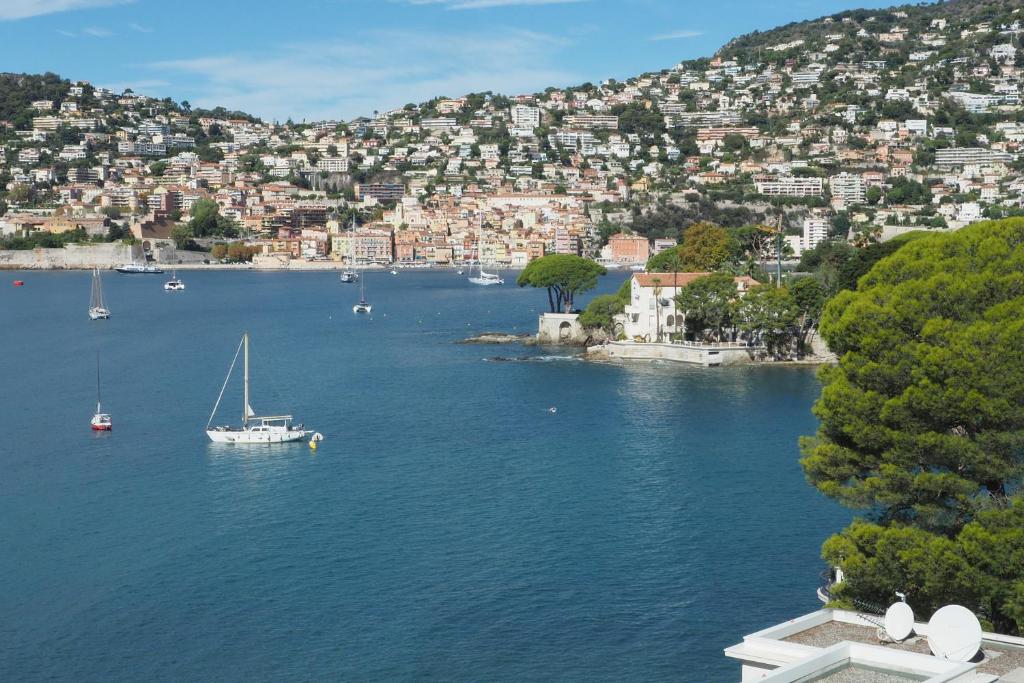 a view of a large body of water with boats at Villa la Felicite in Saint-Jean-Cap-Ferrat
