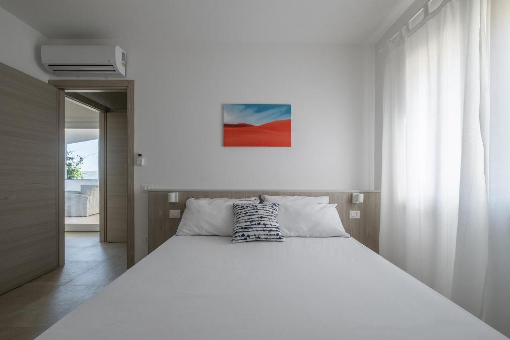 Łóżko lub łóżka w pokoju w obiekcie Le Nacchere Dimore a portata di mare