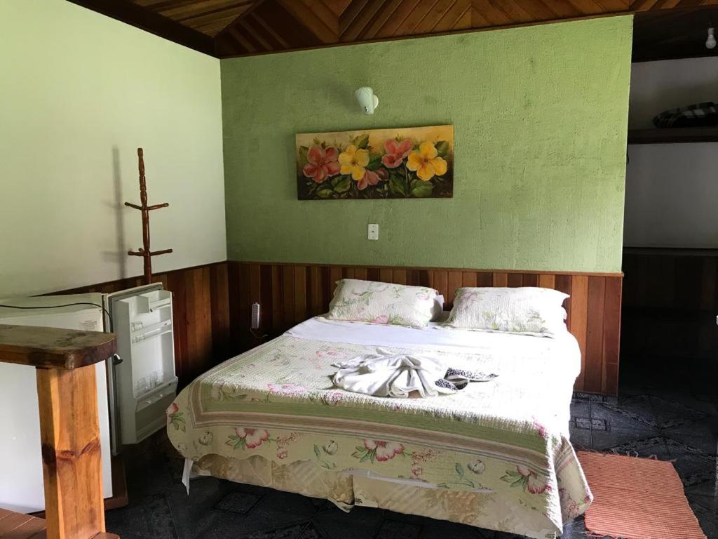 Postel nebo postele na pokoji v ubytování Chalés Aguá Cristalina