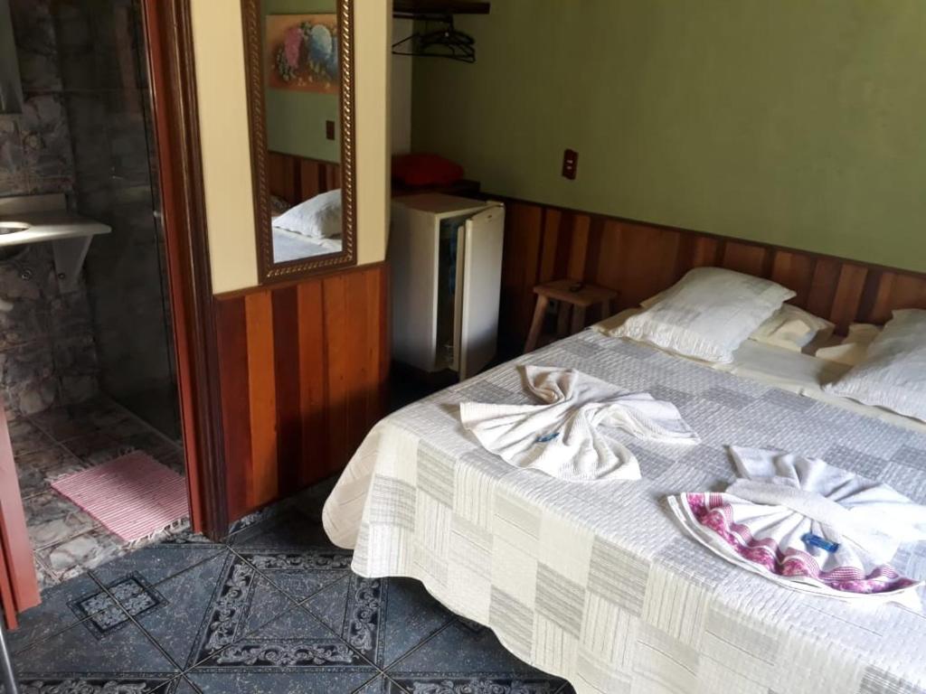 Postel nebo postele na pokoji v ubytování Chalés Aguá Cristalina