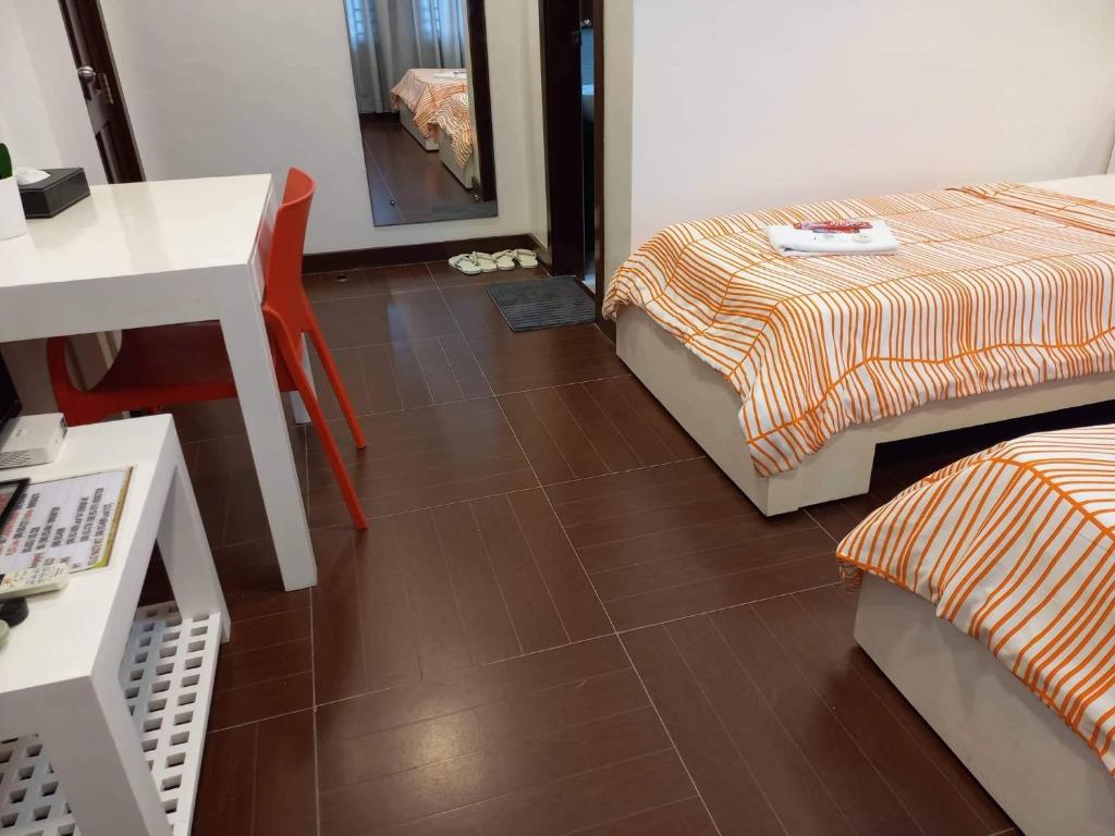 Postel nebo postele na pokoji v ubytování GLC SUITES