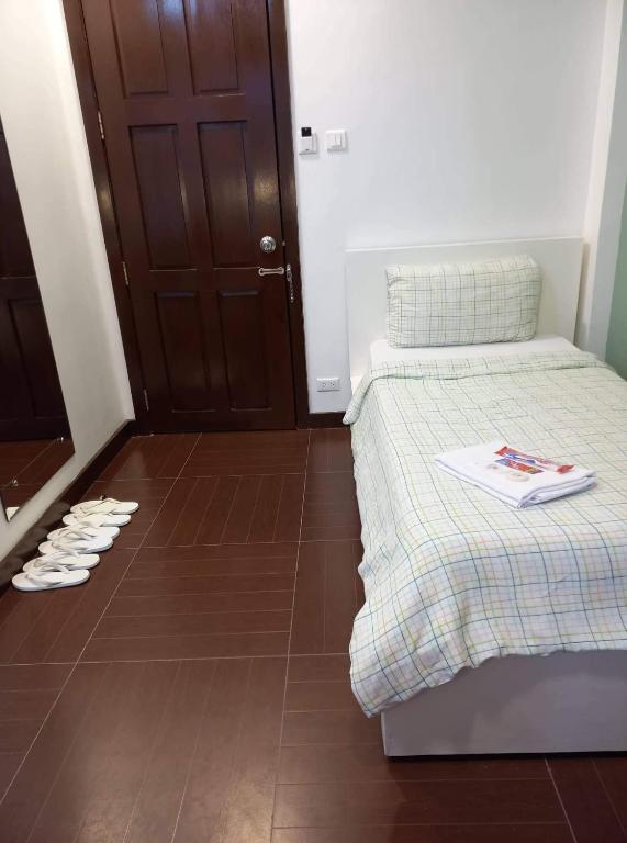 Postel nebo postele na pokoji v ubytování GLC SUITES