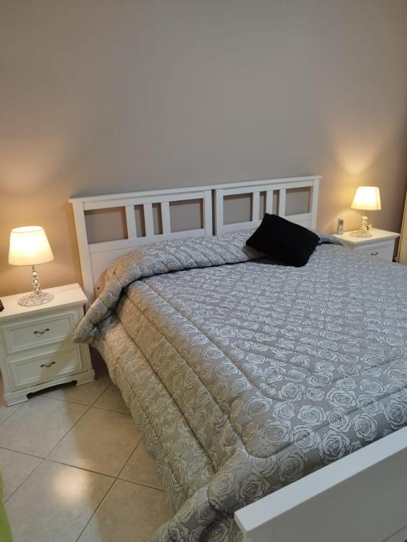 Postel nebo postele na pokoji v ubytování B&B Salita Metello