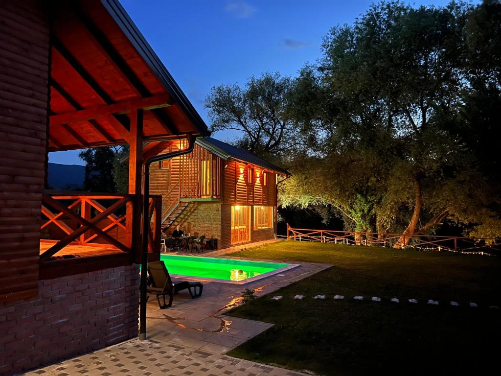 a house with a swimming pool in the yard at Eko vila Krupa in Krupa na Vrbasu