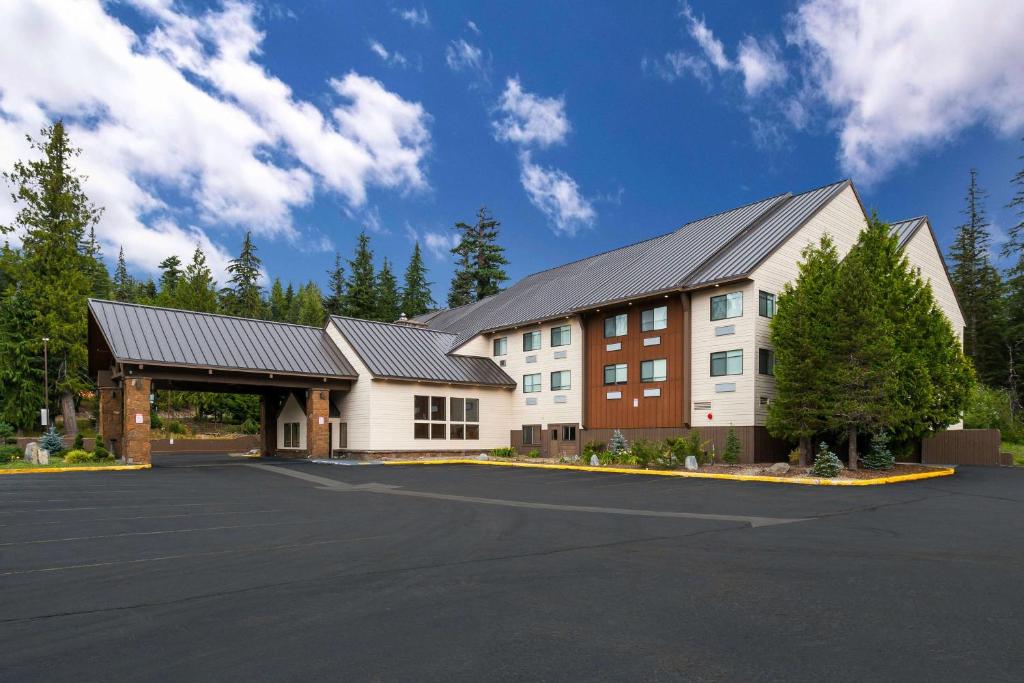 a large building with a parking lot in front of it at Best Western Mt. Hood Inn in Government Camp