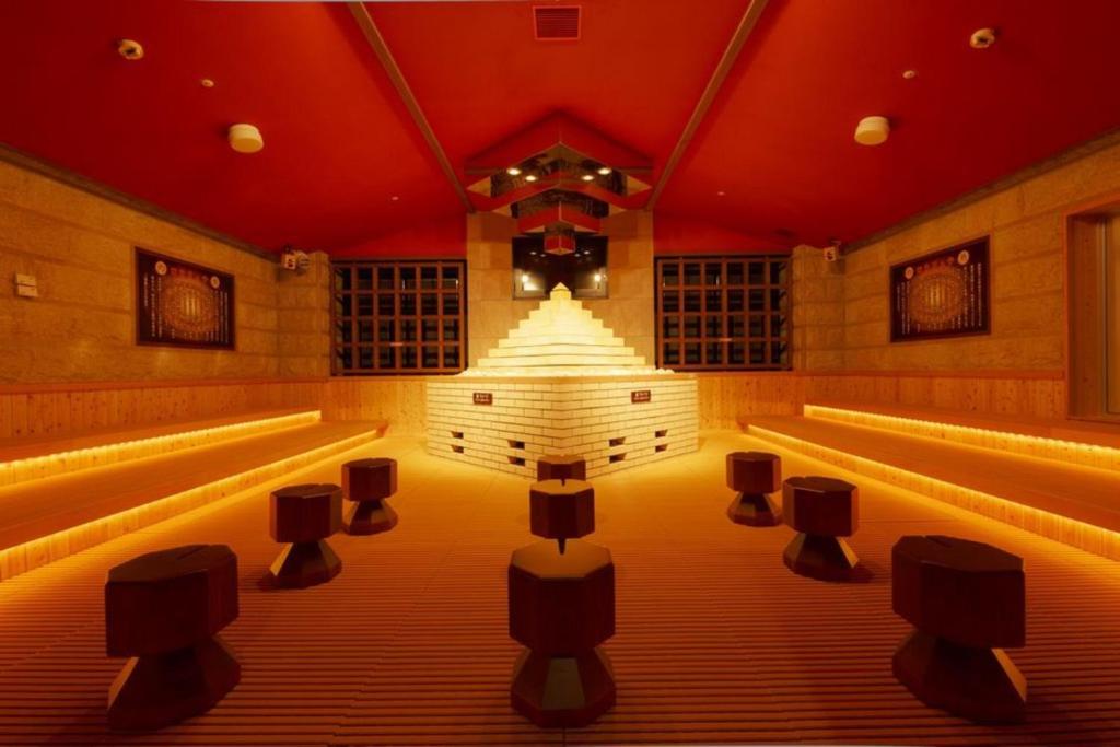 a room with a stage with lights in it at Spa World HOTEL&RESORT in Osaka
