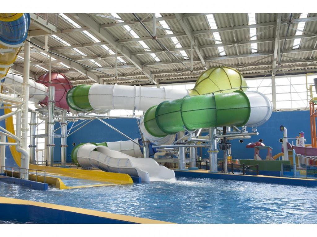 a large water slide in a water park at Spa World HOTEL&RESORT in Osaka