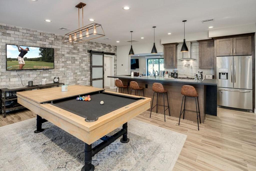 a kitchen with a ping pong table in a room at Private Pool & Spa ** Steps to Old Town ** Sanatized in Scottsdale