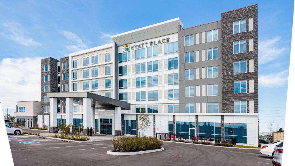 a rendering of a hotel building with a parking lot at Hyatt Place Toronto-Brampton in Brampton