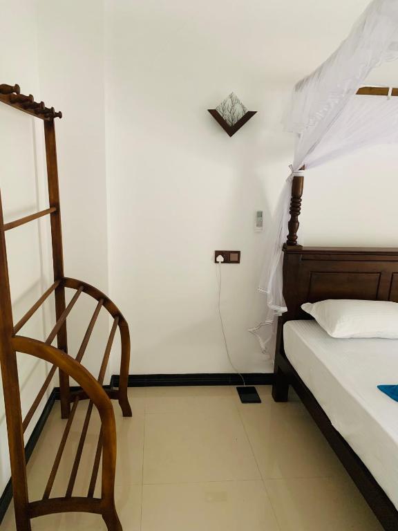 Postel nebo postele na pokoji v ubytování Ramesh Guesthouse