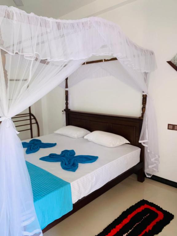 Postel nebo postele na pokoji v ubytování Ramesh Guesthouse