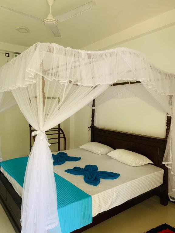 Postel nebo postele na pokoji v ubytování Ramesh Guesthouse