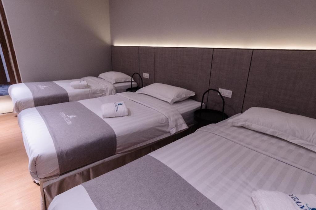 Postel nebo postele na pokoji v ubytování OCEAN HOTEL