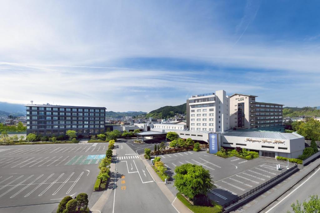 an aerial view of a city with buildings at Hida Takayama Onsen Takayama Green Hotel in Takayama