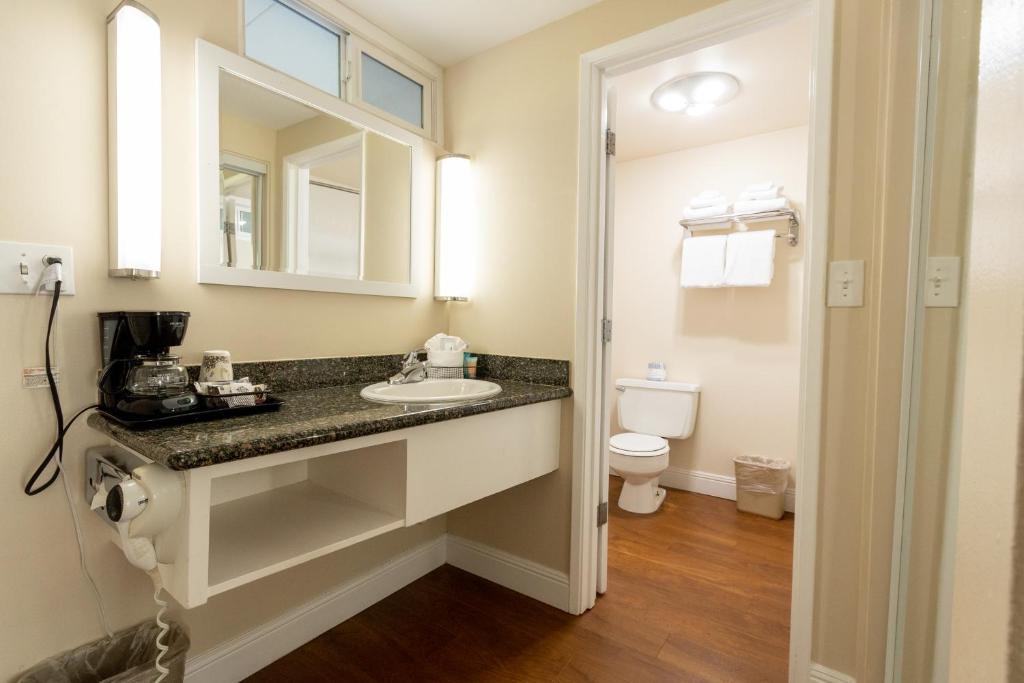 a bathroom with a sink and a toilet at Pea Soup Andersen's Inn in Buellton