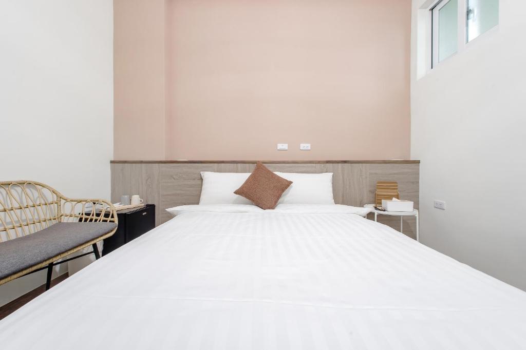 Postel nebo postele na pokoji v ubytování Yu Krung Style Inn