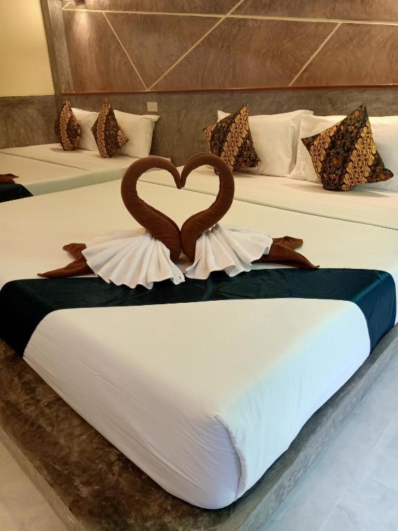 Postel nebo postele na pokoji v ubytování Lanta Pearl Beach Resort