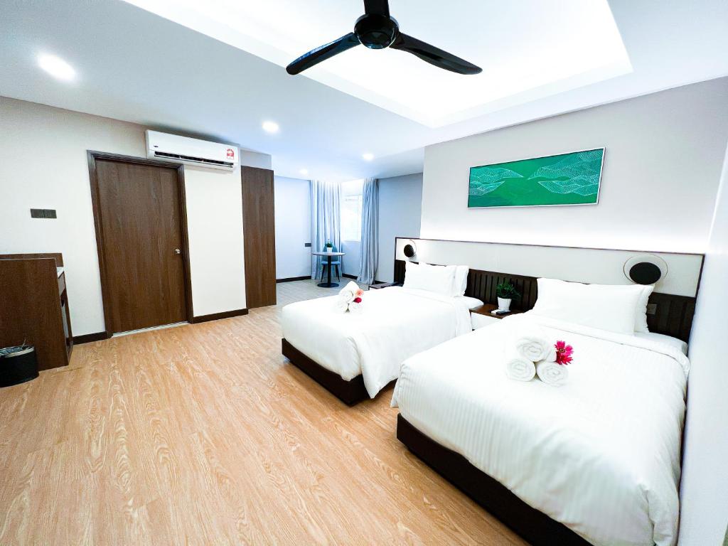 Letto o letti in una camera di Villea Port Dickson