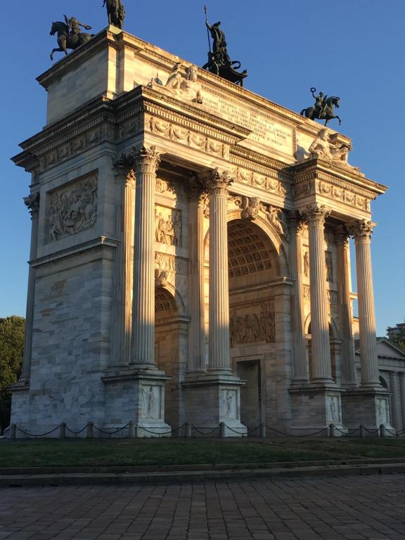 a large building with statues on top of it at Arco della Pace Corso Sempione 12 in Milan