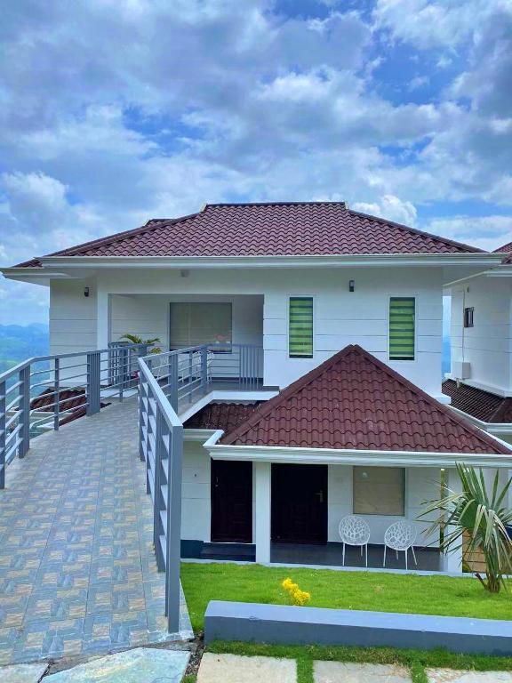 Balkón nebo terasa v ubytování The Windy Mist Resort Munnar