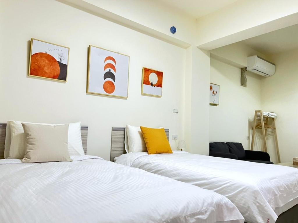 Postel nebo postele na pokoji v ubytování Hourlight Homestay