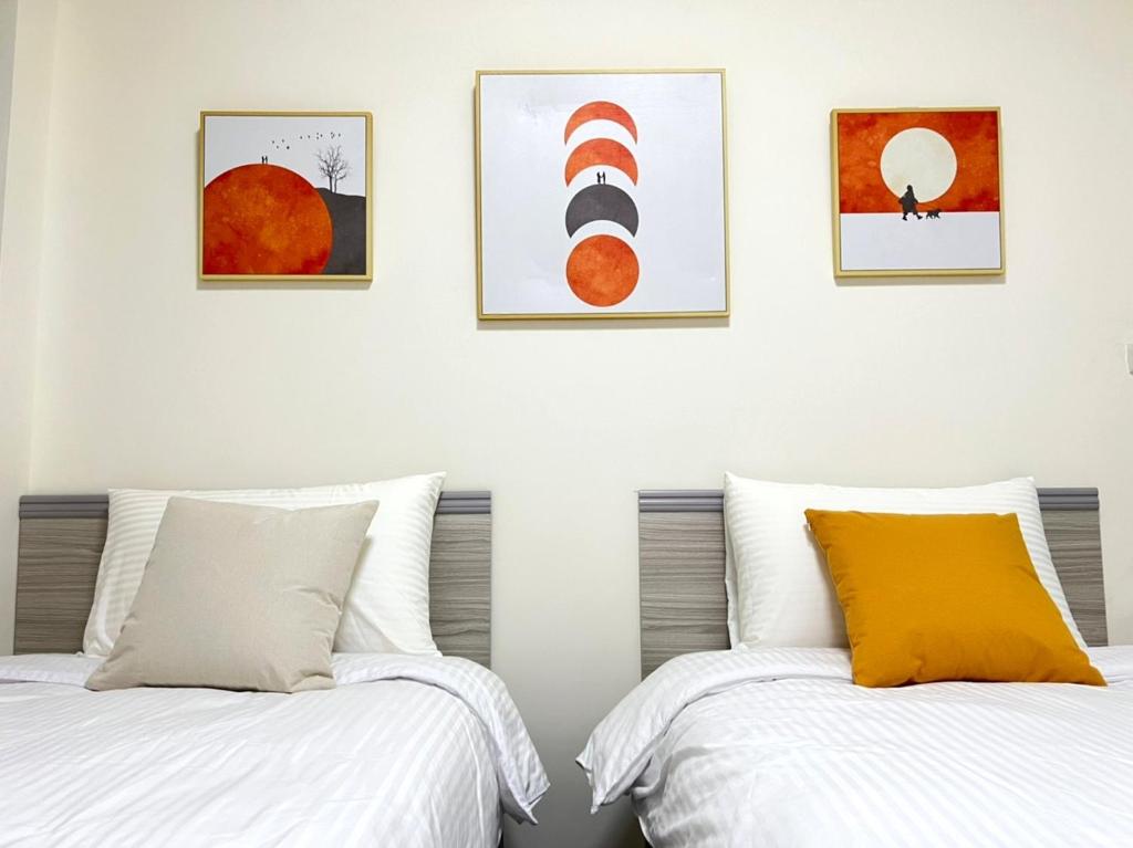 Postel nebo postele na pokoji v ubytování Hourlight Homestay